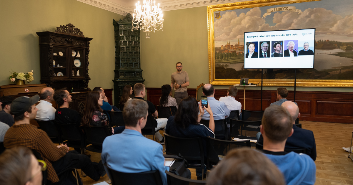 scandiweb co-founder Glebs Vrevsky presenting at the first Baltics AI eCommerce Meetup at House of the Blackheads, Riga, May 2025